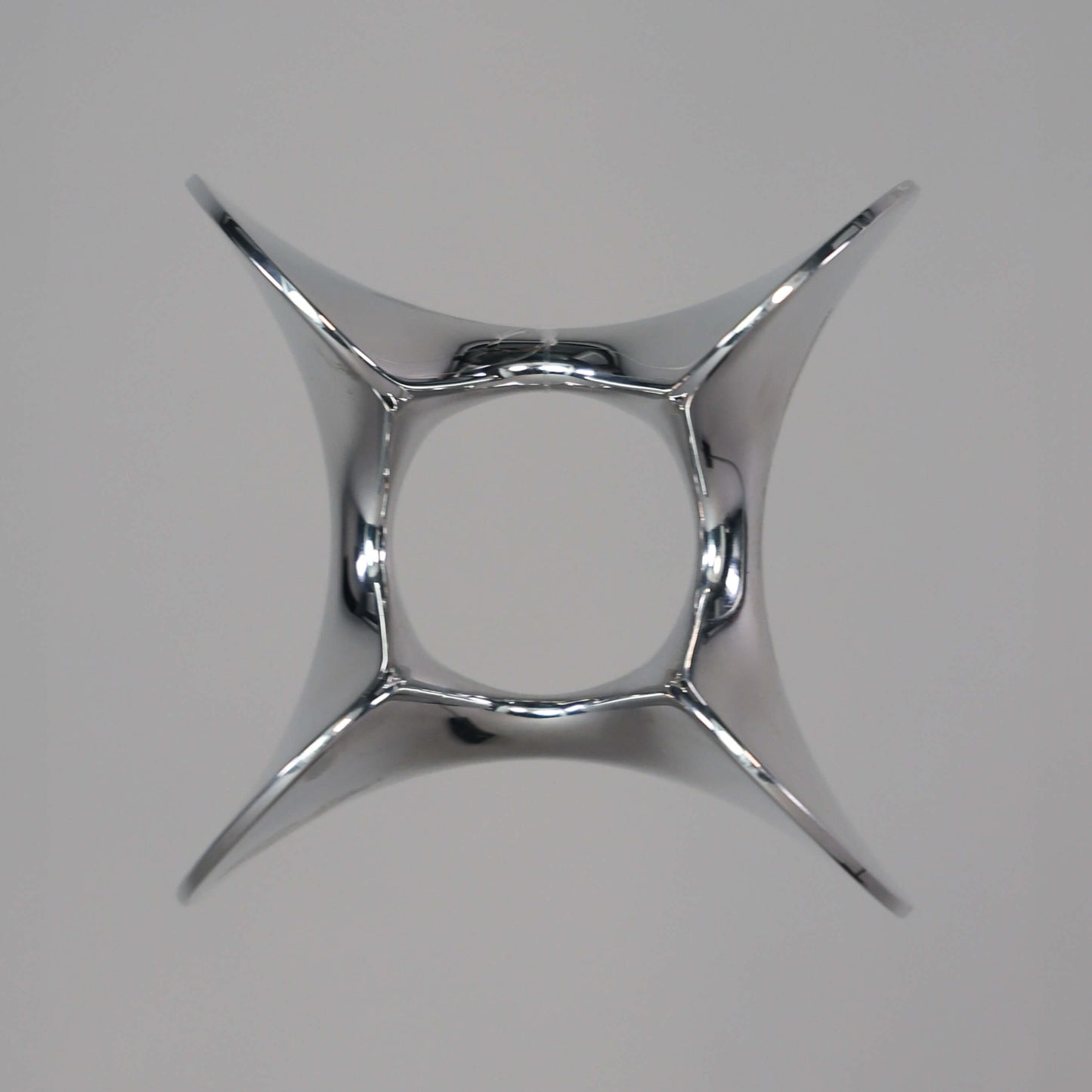 Top view of Googy sculptural aluminium egg cup showing reflective surface and curved form