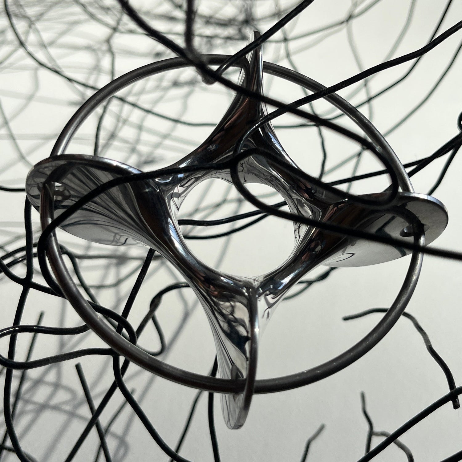 Close-up of pierced Googy aluminium egg cup showing polished surface and oversized jump ring